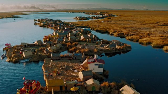 Slowly flying above Uros floating island huts