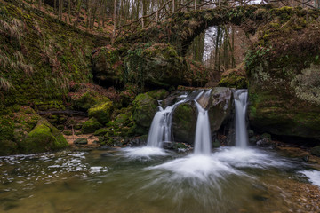 The Schiessentümpel is a small and picturesque waterfall on the Black Ernz river. Mullerthal - Luxembourg’s Little Switzerland.