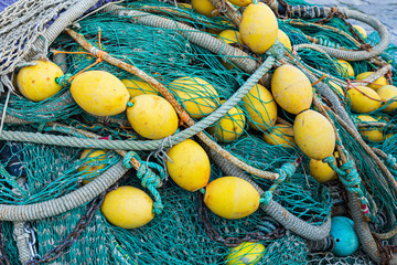 Italy, Apulia, Province of Lecce, Gallipoli. Texture detail of fishing nets in yellow and blue.