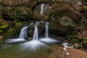 The Schiessentümpel is a small and picturesque waterfall on the Black Ernz river. Mullerthal - Luxembourg’s Little Switzerland.