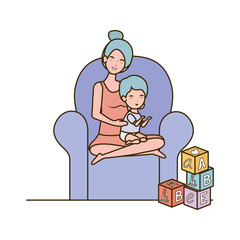 cute pregnancy mother with little boy seated in sofa