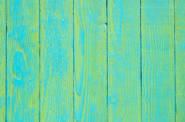 Wooden background texture. Creatively painted green and blue boards.