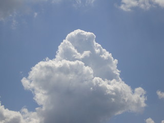 Fluffy White Clouds In Blue Sky Background