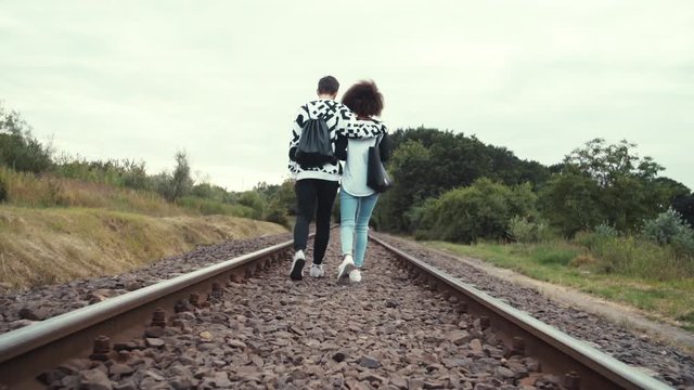  a couple of hipster walks along the tracks