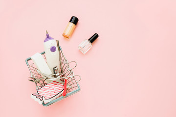 Manicure concept set on pink background. Nails tools, polishing nail buff, cuticle pusher, cuticle...