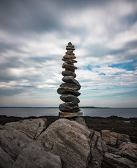 Balanced tower of rocks on the coast 