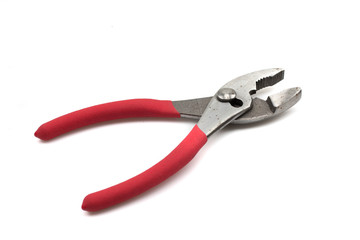 A close up image of a pair of red handled pliers isolated on a white background