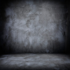 Grunge interior room with concrete wall and floor. Empty concrete space.