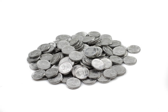 A close up image of a pile of Pakistani rupees isolated on a clean, white background