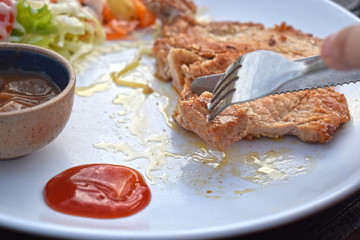  Pork steak with vegetable salads and sauces is a delicious and popular dish.