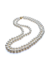 Double strand white pearl necklace with gold clasp. Set on a white background with a shadow under the pearls.