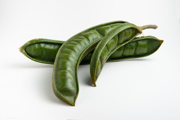 Guaba or cuaniquil: fresh South American fruit on white background