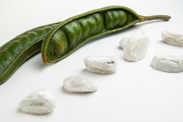 Guaba or cuaniquil: fresh South American fruit on white background