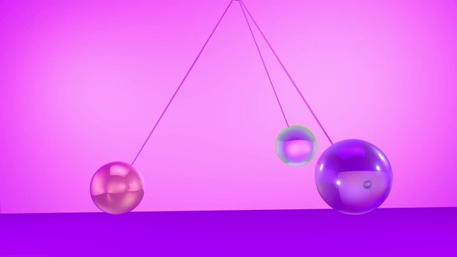 Pendulum back and forth movement of spheres on a glassy colorful background