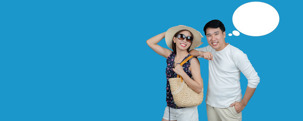Asian couples stand smiling, happy and relax on summer holiday. By looking for interesting tourist...