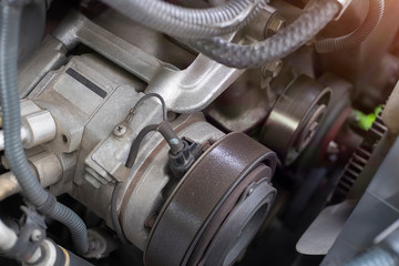 Fix car a wrench on hand with engine car on background.