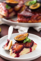 Slice of caramelised plum upside-down cake