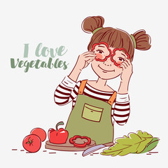 Cute girl playing with vegetables. Happy kid having fun making salad in the kitchen, holding pepper slices as glasses