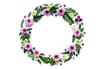 Round frame flowers and berries pattern. Floral Template for wedding or greeting card on a white background. Copy space