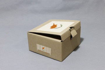 Cyprus flag on brown box with barcode and the color of nation flag, paper packaging for put products.