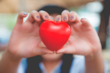 Woman hold red heart