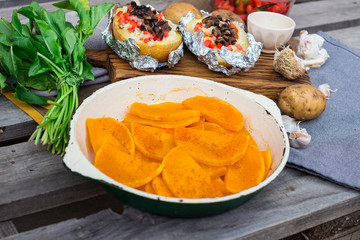 Orange baked squash, grilled pumpkin in frying pan. Vegetarian lunch and vegan food