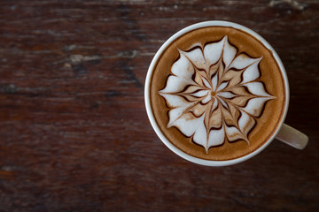 Obraz na płótnie Canvas Cup of coffee with latte art on top