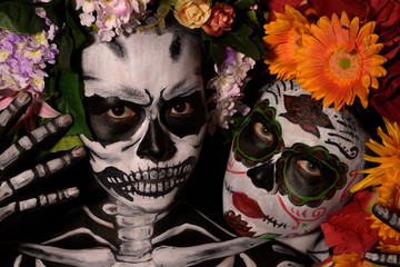Halloween, Day of the Dead portrait body paint decorated with flowers, Horror concept.