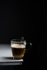 Cup of coffee on white table
