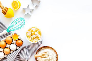 Baking background. Dough ingredients on white background top view copy space