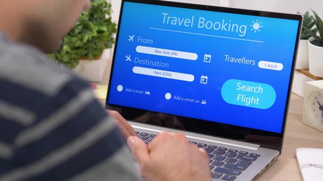 Booking a hotel room online on a laptop portable computer screen.