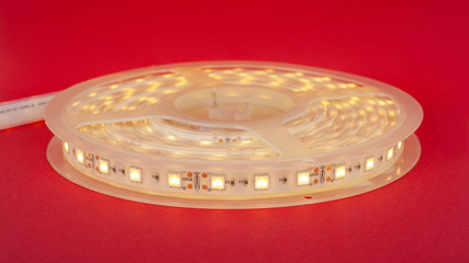 LED decorative luminous strip.diode light on a red background