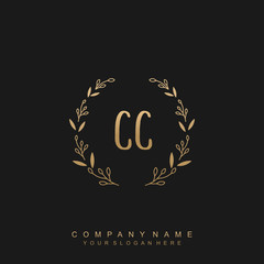 letter CC surrounded by beautiful and elegant flowers and leaves. Wedding monogram logo template.