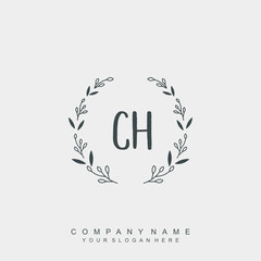 letter CH surrounded by beautiful and elegant flowers and leaves. Wedding monogram logo template.