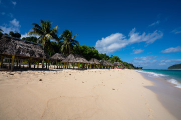 Beach fale's on a white sand beach on Lalomanu, Samoa