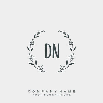 letter DN surrounded by beautiful and elegant flowers and leaves. Wedding monogram logo template.