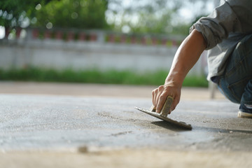 Asian worker labor working with concrete cement floor