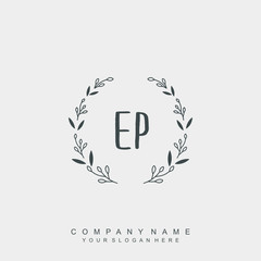 letter EP surrounded by beautiful and elegant flowers and leaves. Wedding monogram logo template.