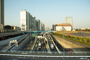 Fototapeta na wymiar View landscape and cityscape Odaiba downtown from MRT train Rinkai Line running journey go to tokyo big sight in Ariake town at Koto city in Tokyo, Japan