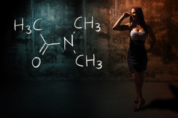 Sexy girl or secretary or female student presenting handdrawn chemical formula of Dimethylacetamide