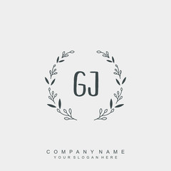 letter GJ surrounded by beautiful and elegant flowers and leaves. Wedding monogram logo template.