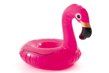 Poster Beach relaxation, the fun and joy of learning to swim and happy summer conceptual idea with inflatable pink lifebuoy in the shape of a flamingo isolated on white background with clipping path cutout © Victor Moussa