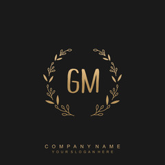 letter GM surrounded by beautiful and elegant flowers and leaves. Wedding monogram logo template.