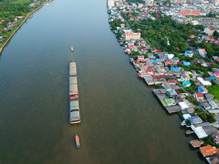 Aerial view of the large cargo ship in the  Chao Phraya River, Bangkok, Thailand.