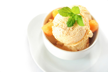 Fresh melon ice cream with melon and melissa isolated on white background 