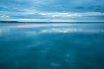 Sea and sky with clouds at sunset.