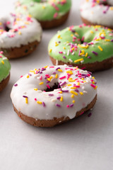 White and green Sprinkled delicious doughnuts.