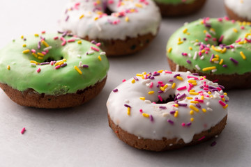 White and green Sprinkled delicious doughnuts.