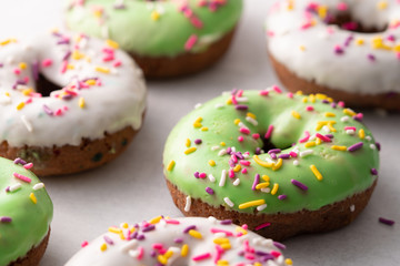 White and green Sprinkled delicious doughnuts.