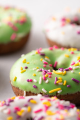 White and green Sprinkled delicious doughnuts.